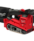 Tough As Nails Cordless Belt Sander With 3X18 Wide Sanding Path And Beefy Brushless Motor, red design with dust collection bag.