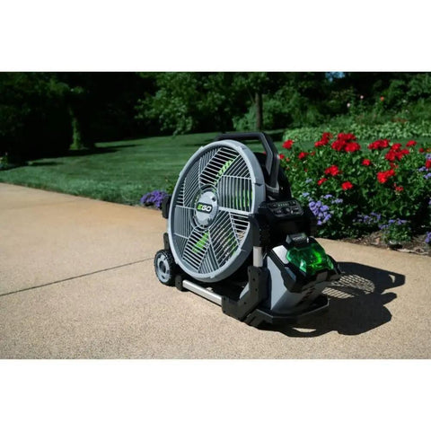 Image of Go To Outdoor Mist Cooling Fan With 18 Inch Blade, 5 Speed Settings, Delivers Up To 5,000 CFM, Two Misting Modes, Telescopic Handle And Rolling Wheels, Battery And Charger Not Included, Your Backyard Cooling Buddy on a patio.