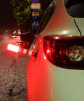Must Have Emergency Roadside LED Flares Kit With Magnetic Base And Detachable Stand attached to car at night
