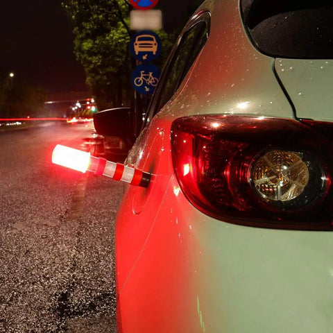 Must Have Emergency Roadside LED Flares Kit With Magnetic Base And Detachable Stand attached to car at night