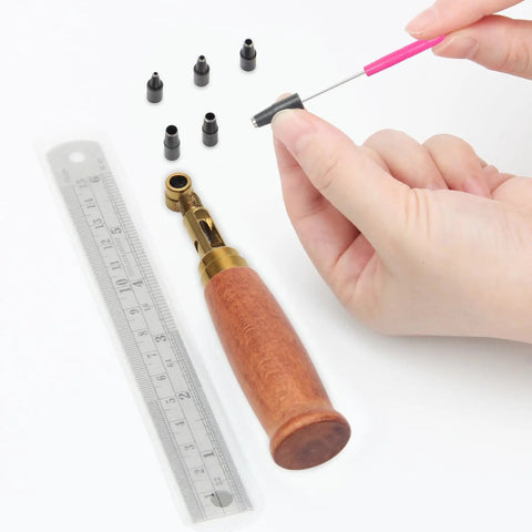 Heavy Duty Brass Leather Hole Punch With A Comfy Wooden Handle with drill bits and ruler for crafting and DIY.