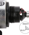 Close-up of mini pneumatic chamfering tool head with replaceable blade and metal body, showing 45° chamfer.