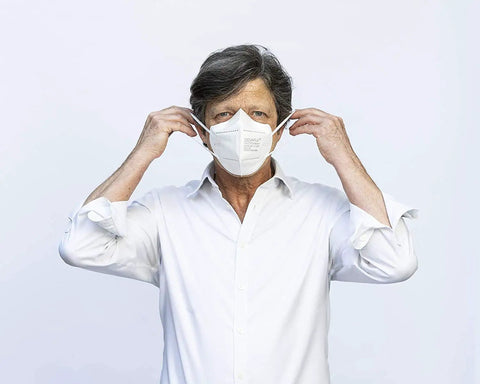 Man wearing Premium KN95 Face Mask for Adults with adjustable nose bridge and non-latex ear loops for all-day wear and travel.