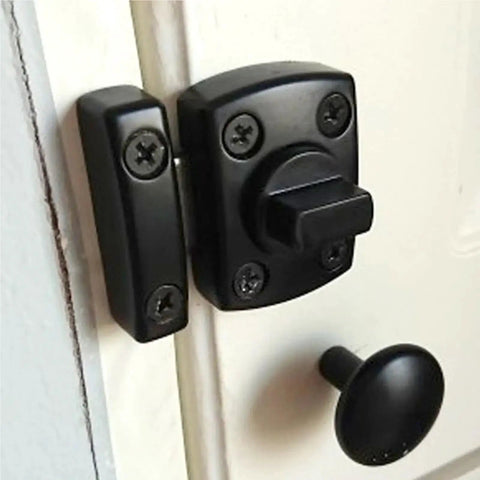 Tough As Nails Double Sided Gate Latch Slide Bolt Lock with large black sturdy security hardware installed on a white door.