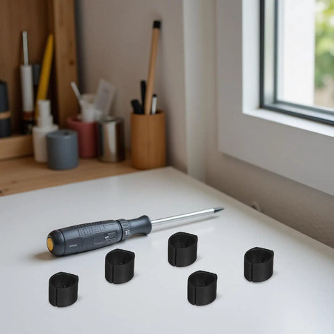Five black U Shaped Chair Leg Caps Floor Glides For Bar Stools And Hardwood Floors Easy Clip On displayed on a desk