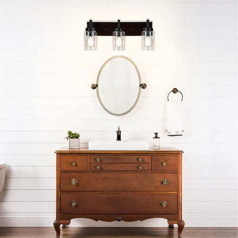 Vintage Vibes Wall Light Fixture With 3 Clear Glass Shades In Matte Black Finish over bathroom mirror