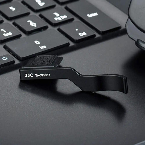 Deluxe Metal Thumb Up Grip For Fujifilm X Pro 3 X Pro 2 X Pro 1 Mirrorless Cameras With Hot Shoe Mount on laptop keyboard.