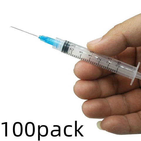 Hand holding 15 Pack 3ml 23 Gauge Plastic Syringe With Measurement For Lab Use And Industrial Dispensing Disposable Individually Wrapped Luer Lock 1 Inch Barrel Secure Cap