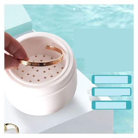Premium Portable Ultrasonic Cleaner For Jewelry And Watches with golden bracelet inside, compact design for gentle cleaning.