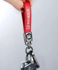 Hella Durable Red Leather Auto Keychain With Slick Zinc Alloy Strap Tough Key Fob Lanyard For Honda Accord Civic Crv Pilot, close-up.