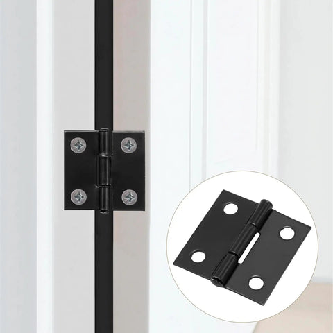 Close-up of a solid black one inch metal hinge installed on a white cabinet door, part of a 24 Pack Of Solid Black One Inch Metal Hinges With Included Fasteners Quick Hook Up For Drawers Cabinets And Small Craft Boxes Built Tough For Heavy Duty Jobs.