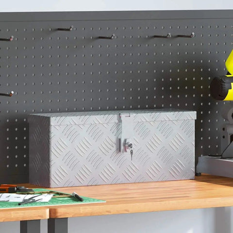 Built Tough Aluminum Tool Box With Locking System And Two Keys on a workbench, showing corrugated design and silver color.