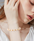 Woman wearing bracelet made with Two Tone Flower Bead End Caps Set With 1260 Pcs Iron Filigree Bead Caps Gold Spacer Beads
