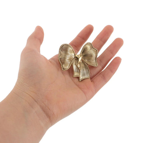 Luxurious Vintage Brass Bow Drawer Handles For Furniture And Boxes. Small gold bowknot pull in hand, solid brass, decorative cabinet handle.