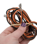 Close-up of hand holding wiring for 1/8 HP HVAC Condenser Motor For Central AC, 1 Phase, 1075 RPM, 208 To 230V setup.