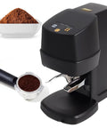 Automatic Espresso Tamper For 58 Mm Portafilters, black tamping machine with coffee grounds and portafilter, compact design.