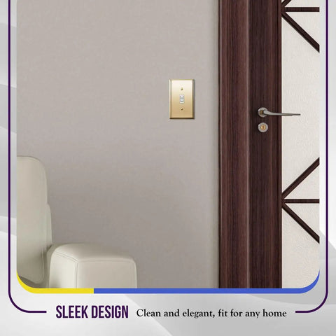 Polished Brass 1-Gang Toggle Light Switch Wall Plate In Gold Finish in modern interior, next to brown door and white chair.