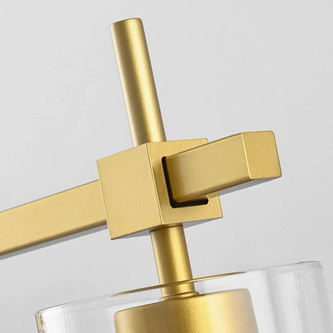 Close-up of the Gold Three Light Bathroom Vanity Fixture Set For Mirror And Wall Sconce showing golden arm and clear shade