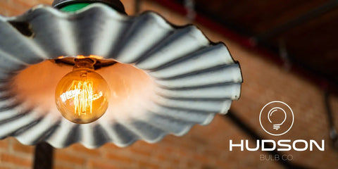 Retro Edison Style LED Bulbs 6W G25 Globe 4 Pack Warm 3000K Soft White Dimmable 60W Equivalent E26 E27 Base For Vanity Mirror And Room Decor Ideal For Chandeliers And Vanity Lighting In Homes And Small Businesses shown in a decorative fixture.