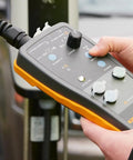 Slick Heavy Duty Type One Electric Vehicle Charging Station Diagnostic Adapter For Testing Level 1 And Level 2 Ac Systems With Gfci And Ground Safety Checks Plug Right In, showing close-up controls.