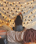Cozy bedroom setting with Dimmable Starry Copper String Lights, 66 Feet Long With 200 LEDs, USB Powered Plug In for Indoor Ambiance.