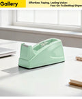 Cute Aesthetic Office Desk Tape Dispenser Green Fits Standard 1 Inch Core Tapes Easy Reload In Seconds Slick Smooth Cut Design For Quick Everyday Wrapping And Mess Free Desks on a white desk