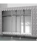 Heavy Duty Portable Wardrobe Closet With Zipper Dust Shield Cover And Sturdy Hanging Rods Plus Spacious Shelves side view showcasing hanging space and decorative cover.