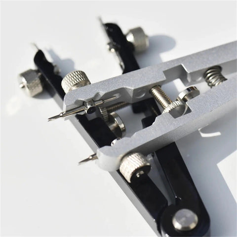 Close-up of Pro Grade 6 Piece Watch Repair Kit for Strap Replacement and Pin Remover with precision tips on white background.