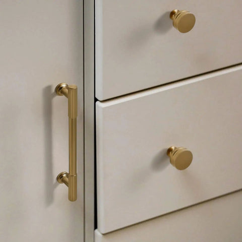 1.17 Inch Champagne Bronze Cabinet Knobs Set Of 2, Solid Zinc Alloy, Rust Resistant, mounted on white dresser drawers