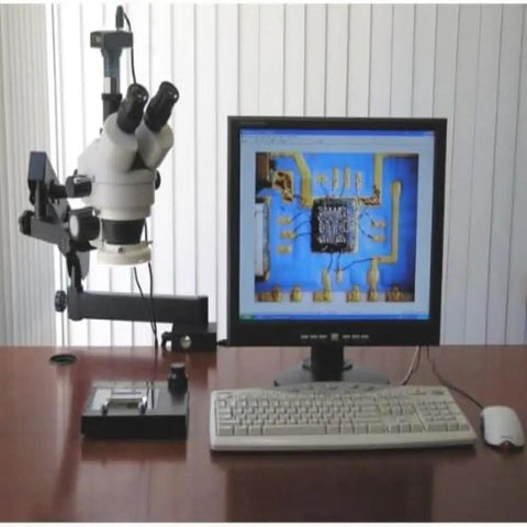 Professional Trinocular Stereo Zoom Microscope With Long Working Distance For Precision Inspection Of Circuits And Dental Appliances Includes 10x Wide Field Eyepieces For Clear Comfortable Viewing on arm stand beside monitor