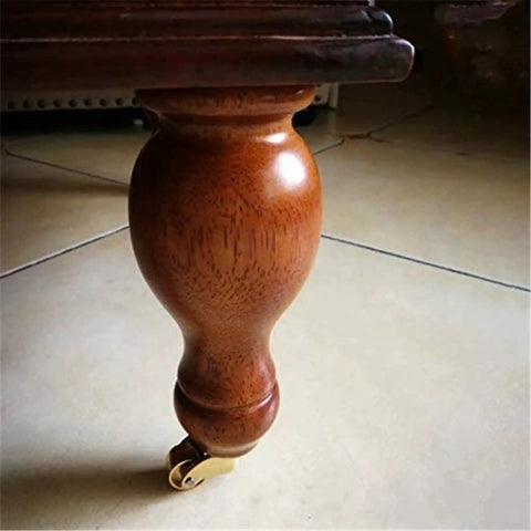 Solid Polished Brass Swivel Casters Set Of Four Vintage Antique Furniture Wheels on wooden leg with smooth caster.