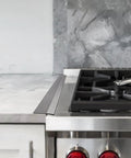 Stainless Steel Stove Gap Covers 23.5 Inches Set next to gas stove and counter, heat resistant and easy to clean oven gap filler.