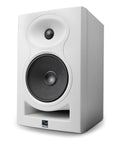 6.5 Inch Powered Studio Monitor White Finish With 1 Inch Soft Dome Tweeter 3D Imaging Waveguide Boundary EQ And Wall Or Ceiling Mount Capability For Accurate Home Studio Mixing. Front view of white speaker.
