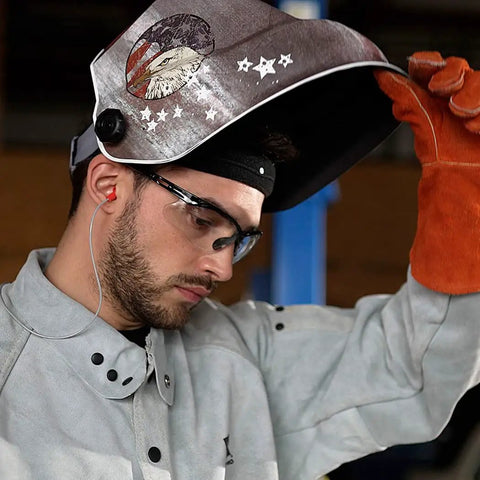 Welder wearing ultra lightweight auto darkening welding hood with premium graphic design weighing 1.24 lbs and ergonomically balanced for fatigue free wear ANSI Z87.1 approved ideal for welding grinding cutting and carbon arc gouging great optical clarity