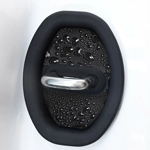 Slick Auto Door Lock Buffers Shield Metal Buckles From Gnarly Scratches While Acting As Sound Deadening Cushions For A Tight Fit And Super Smooth Shuts On Your Daily Driver Keeping Trim Fresh, close-up of black silicone cushion with raindrops.