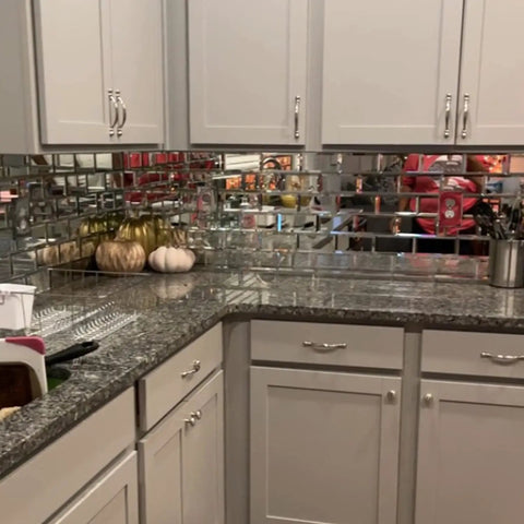 Mirror Peel And Stick Subway Tile Beveled Glass Backsplash in kitchen, reflecting beige cabinets and decor, 3x6 inch self adhesive.
