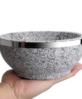 Dolsot Bibimbap Bowl 32 Oz Granite Stone Bowl With Wood Base for Korean Soup Rice and Stew held in hand, showing size and texture.