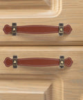 Vintage Leather Trunk Handle Replacement For Cabinets And Drawers Brown Leather Cabinet Pulls installed on wooden drawers