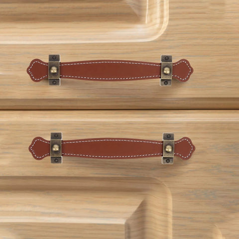 Vintage Leather Trunk Handle Replacement For Cabinets And Drawers Brown Leather Cabinet Pulls installed on wooden drawers