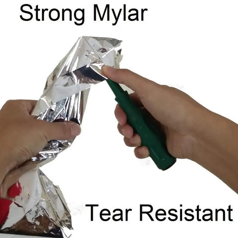 Hands testing tear resistance of Emergency Survival Sleeping Bags 2 Pack For Cold Weather Camping And Outdoor Rescue Mylar Thermal Bivy Sack