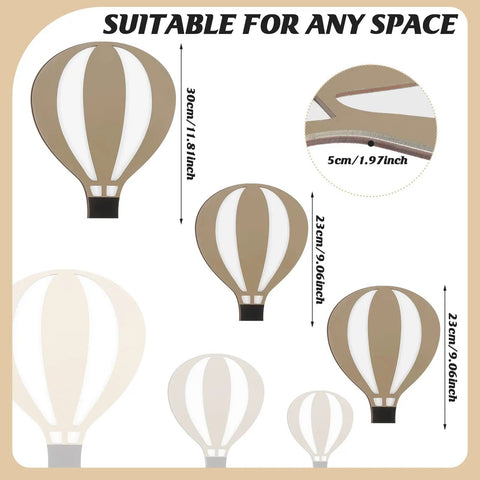 Nine Piece Boho Hot Air Balloon Nursery Wall Decor Kit featuring three wooden hot air balloon shapes in natural wood tone.