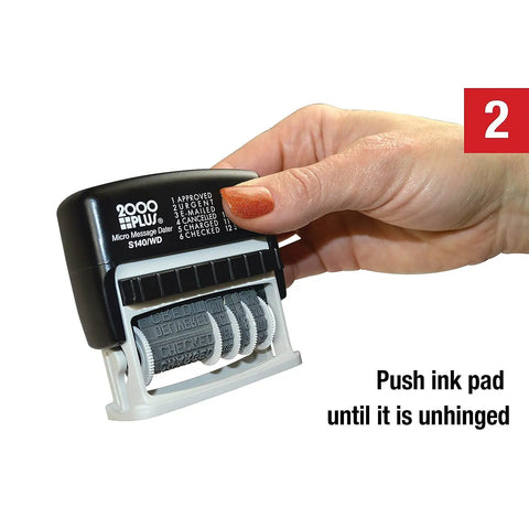 Hand holding a Slick Self Inking Micro Message Dater Stamp With Quick Flip Phrases, showing the ink pad mechanism and phrases.
