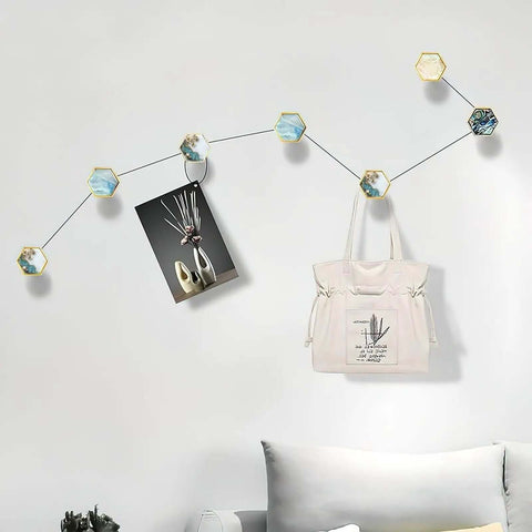 Set Of 4 Hex Cabinet Knobs Made Of Solid Brass With Marble And Gold Cherry Blossom Accents, used as decorative wall hooks