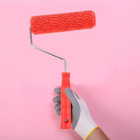Rubber Texture Paint Roller For Easy Peasy Wall Embossing And Quick Home Reno Makeovers That Deck Out Your Space With Knockout Decorative Finishes And Zero Stress, held in hand with a patterned red rubber head.