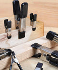 Amazon Basics steel spring clamps set with black PVC-coated tips; assorted 3/4-in and 1-in clamps on wood