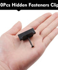 Straight Up Durable Black Nylon Hidden Deck Fasteners Plus T Clips With Heavy Duty Metal Screws For Effortless Composite Board Setup No Fuss Universal Decking Connector Kit 50 Piece shown in hand