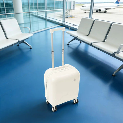 Mint Blue And Pearl White 18 Inch Carry On Suitcase With A Built In USB Charging Port And Roomy Power Bank Pocket For Traveling in airport lounge.