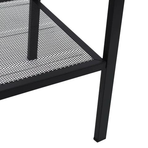 Close-up of mesh shelf on Industrial 4 Tier Metal Ladder Shelf For Books And Plants, black finish, showing metal construction.