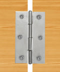 Top Tier 12 Pack Of 2.5 Inch Mini Butt Hinges In Classic Silver Finish showcasing stainless steel hinge mounted on wood.