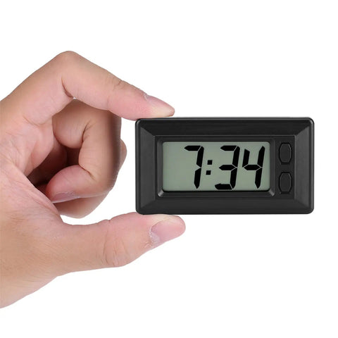 Ultra Thin Digital Clock With Wide Lcd Panel And Adhesive Mount For Car Dashboard Home Desk in hand showing time 7:34